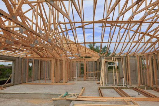 Block home with roof trusses on, under construction viewed from inside