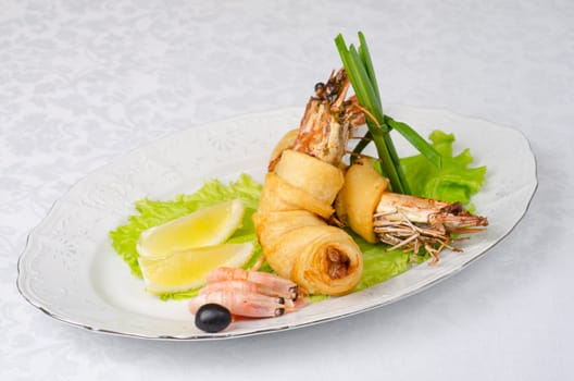 shrimps, with lettuce, green onion, lemon and black olive