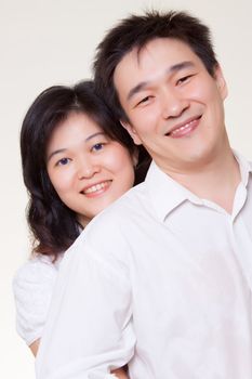 Asian couple hugging white shirt on white background