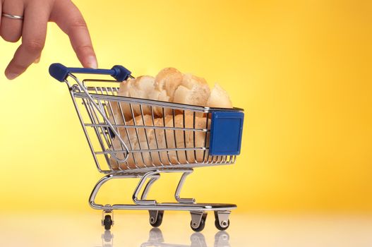 metal shopping trolley filled with bread