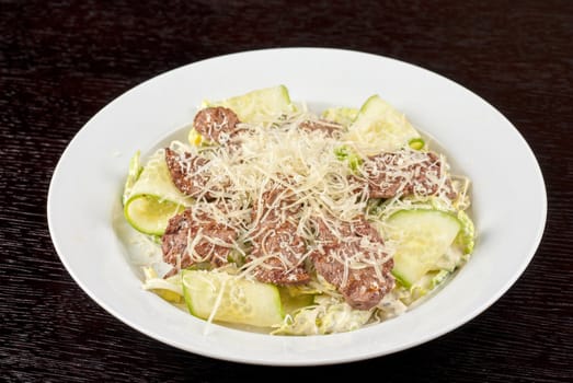 Salad with beef, lettuce, cucumber, string beans, Chinese cabbage and sauce