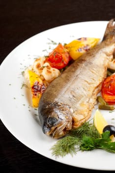 trout fish baked with pepper, string beans, tomato and cauliflower