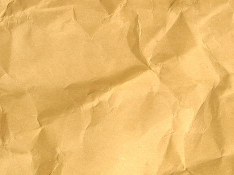 Sheet of brown and rippled paper background