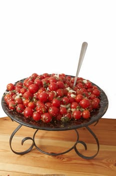 Fresh cherry tomato  salad in bowl .