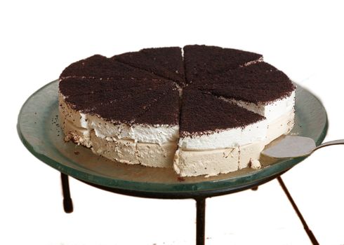 Cream cake with chocolate isolated on a white background .