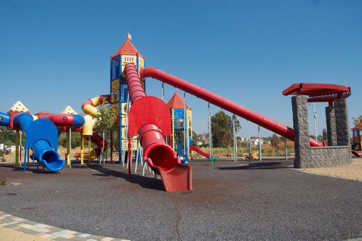 Outdoor kids playground with bright colors .