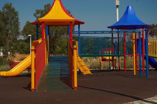 Outdoor kids playground with bright colors .