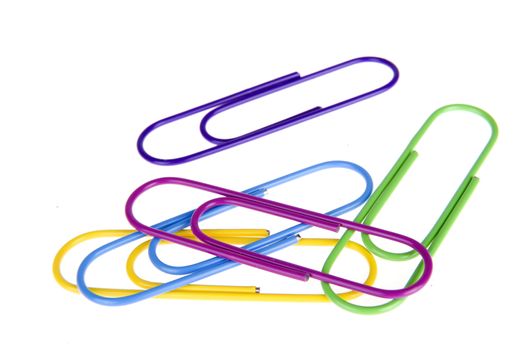 five colorful paperclips on a white background