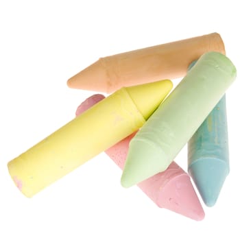 five colorful chalks on a white background
