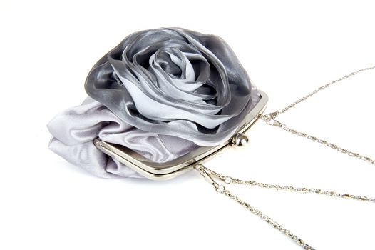 a silver handbag on a white background