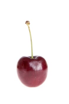a cherry on white