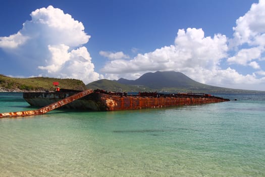 A wrecked barge serves as a makeshift fishing pier in Major's Bay - St Kitts.