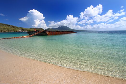 A wrecked barge serves as a makeshift fishing pier in Major's Bay - St Kitts.