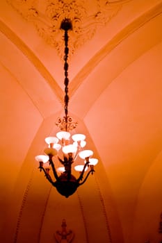 Row of lapms on the ceiling of the underground hall