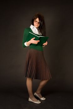 Businesswoman reading book isolated on black