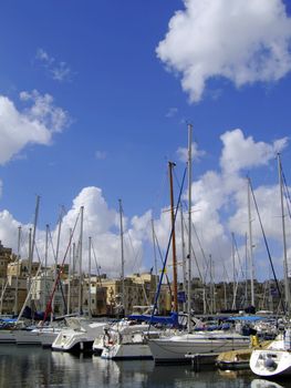 Beautiful yachts moored at the Vittoriosa Yacht Marina in Malta in the Med