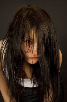 Sensual girl looking in camera isolated in studio