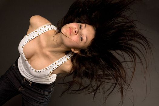 Attractive girl shaking her head isolated in studio