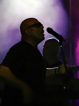 Popular vocalist and his rock band from Malta performing at outdoor gig