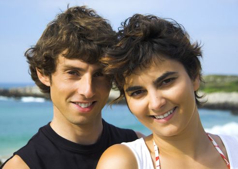 Portrait of a beautiful young couple on the beach