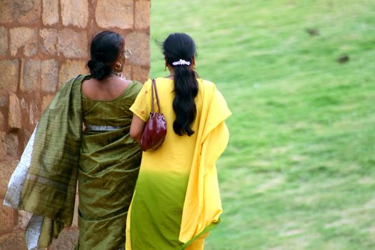 Women wearing beautifully embroidered sari