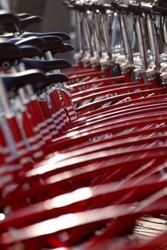 a row of red bicycles in perspective
