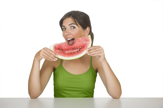 Beautiful young woman eating a slice of watermelon 