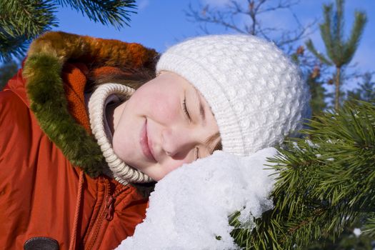 Happy young girl on the snow