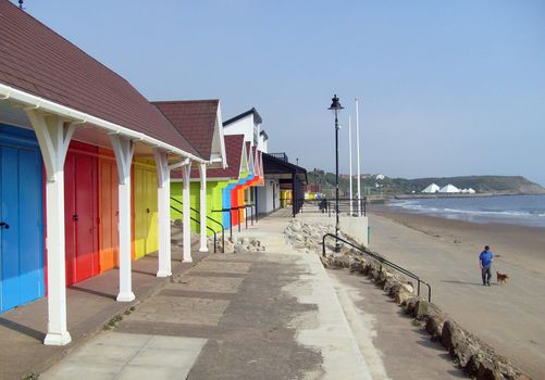 Colorful beach chalets by seaside, Scarborough North Bay, England, U.K.