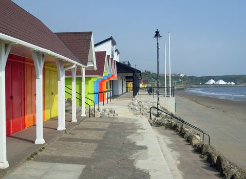 Colorful beach chalets by seaside, Scarborough North Bay, England, U.K.