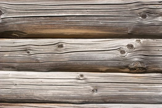 Weathered log house wall background