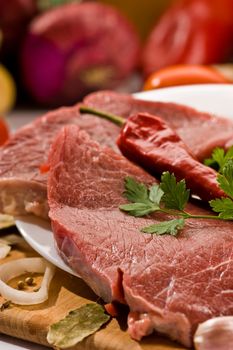 macro picture of meat and vegetables on the wood board