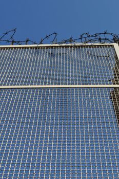 Detail of a barbed wire fence protection