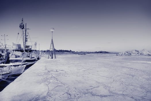Fishing boats at the port , toned photo