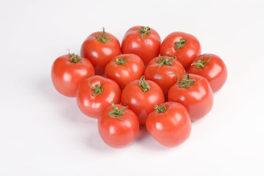 fresh red tomatoes ready for salad, on white background
