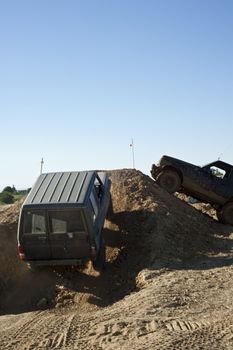 Jeep coming out of a muddy hole during a demonstration