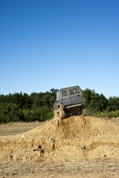Jeep coming out of a muddy hole during a demonstration