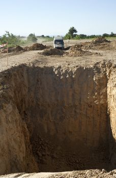 Jeep coming out of a muddy hole during a demonstration