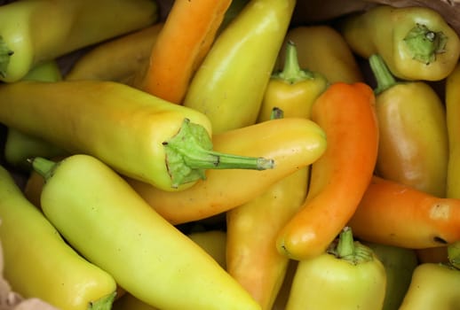 Yellow chili peppers shown for sale at the market