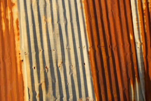 A rusted wall made of corrugated sheet metal