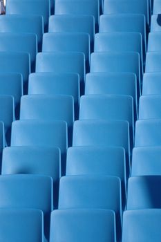 Long rows of blue chairs.