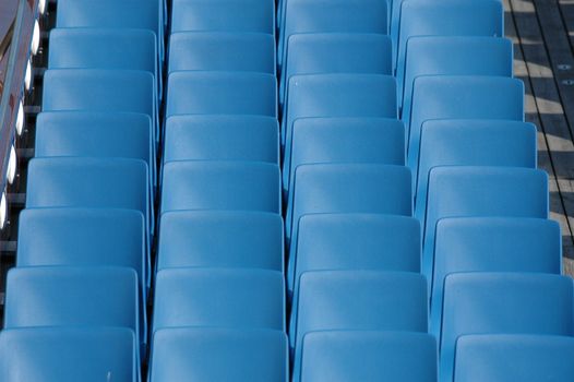 Long rows of blue chairs.