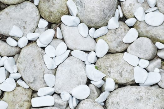 Grey and white ornamental pebbles of different sizes