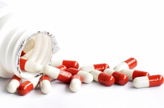 Closeup of medicine capsules on a white background