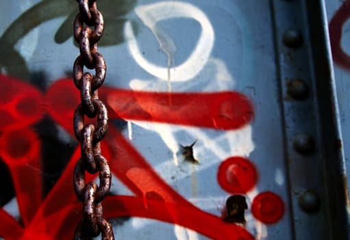 Chain with spray paint in background 