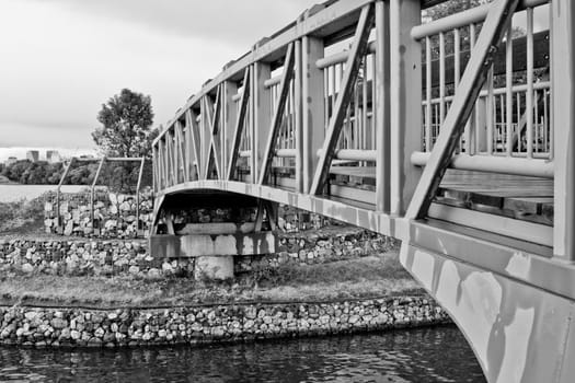 A small bridge for pedestrians crossing Wascana Lake in Regina, Canada