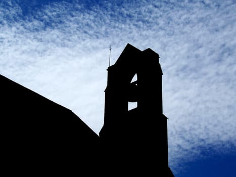 silhouette photo of a church bell tower