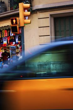 The blu-yellow taxi in the Spain