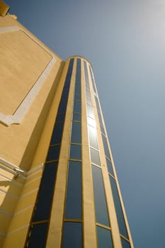 Tower and windows. Clear blue sky