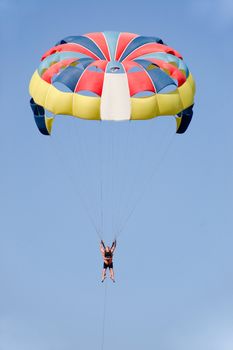 Paraglider is flying in the air.